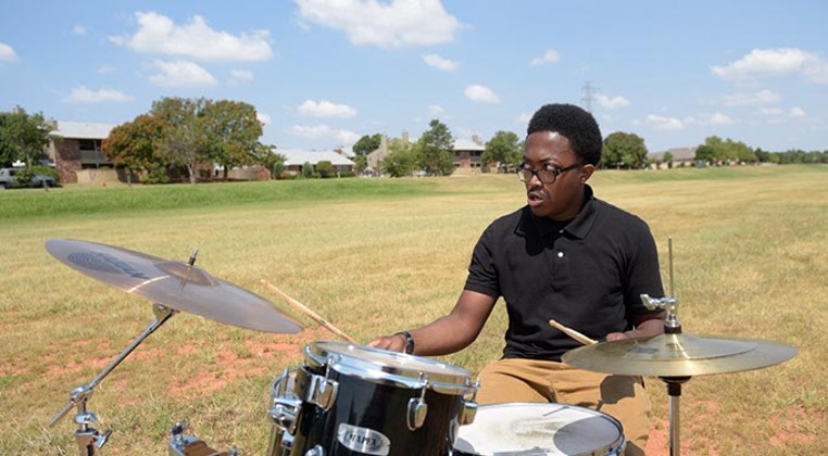 To the delight of his neighborhood, a local drummer practices in Quail Creek spillway