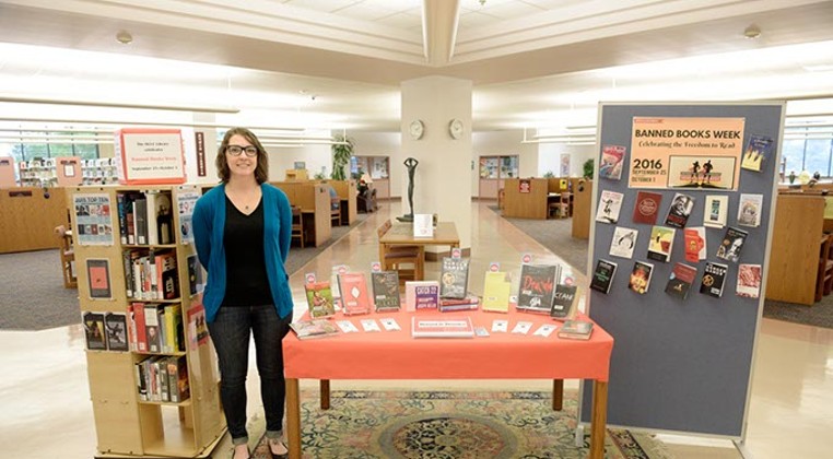 Librarian Tricia Sweany stands by a banned books display at Kieth Leftwich Memorial Library at Oklahoma City Community College. (Garett Fisbeck)