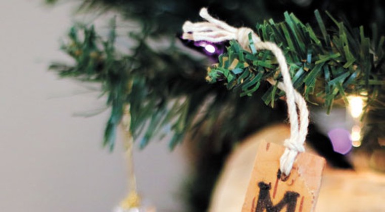 Representatives of the Citizen Potawatomi Nation decorated their tree with a birch bark tag featuring &#147;MKO,&#148; which translates to &#147;Bear.&#148; | Photo Doug Hoke / Red Earth / provided