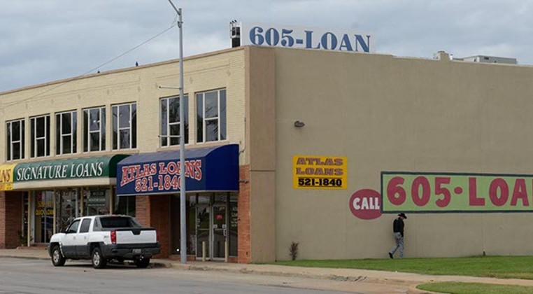 Quick Loans, Signature Loans and Atlas Loans operate along NW 23rd Street near Broadway Exchange. (Garett Fisbeck)
