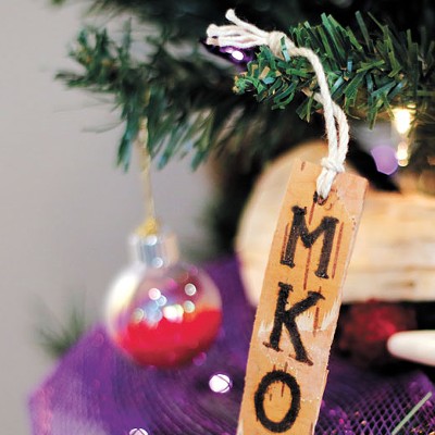 Representatives of the Citizen Potawatomi Nation decorated their tree with a birch bark tag featuring &#147;MKO,&#148; which translates to &#147;Bear.&#148; | Photo Doug Hoke / Red Earth / provided