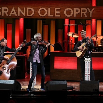 Kyle Dillingham & Horseshoe Road performing on the Grand Ole Opry stage.