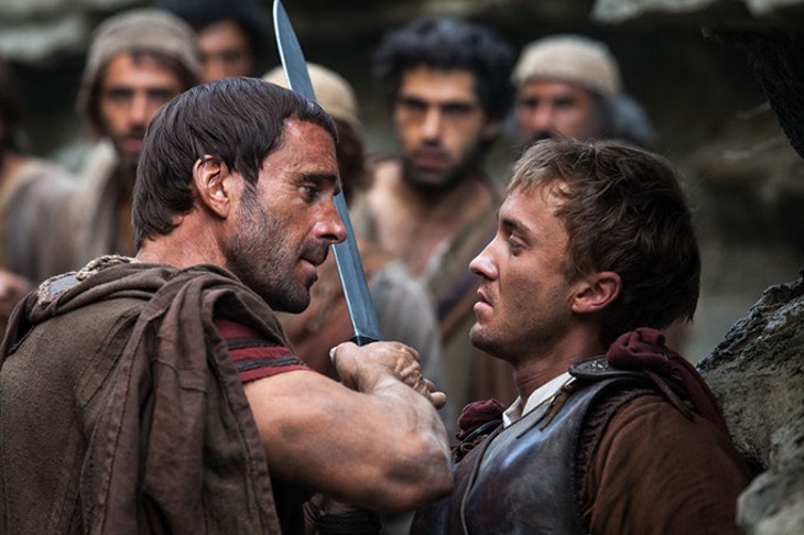 Clavius (Joseph Fiennes, left) warns Lucius (Tom Felton) to let them all pass after he discovers him leading the apostles away from Roman soldiers in Risen. (CTMG / Rosie Collins / Provided)