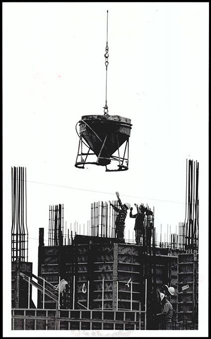 Workers guide a load of concrete during jail construction in March 1990. (Oklahoma Publishing Company Collection / Courtesy Oklahoma Historical Society)