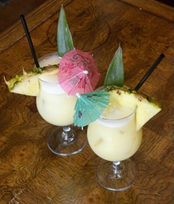 Two Pi&ntilde;a Coladas at Rockford Cocktail Den (Garett Fisbeck)