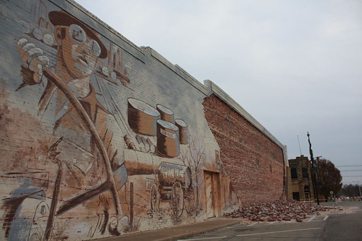 A wall of mural bricks fell from the Lions Club building in downtown Cushing following a 5.0 magnitude earthquake in November. | Photo Laura Eastes