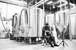 Cellist Steuart Pincombe performs during Anthem Brewing Company&#146;s live music series. Shows can typically be seen Fridays and Saturdays at the brewery&#146;s taproom. | Photo Nigel Bland Company / provided