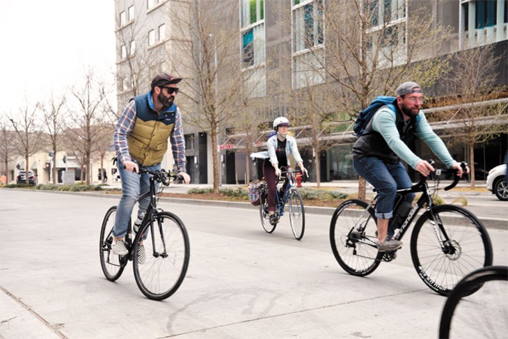 Cyclists travel in downtown Oklahoma City to visit proposed bicycle infrastructure in bikewalkokc&#146;s draft plan last week. | Photo Laura Eastes