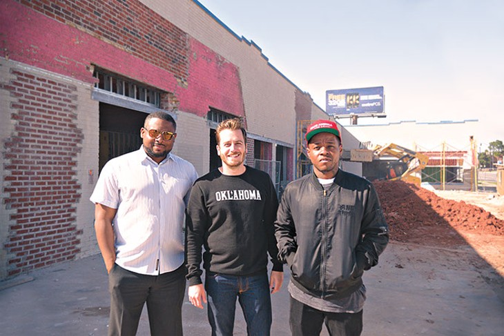 From left: Sandino Thompson, Jonathan Dodson and Jabee Williams stand at the entrance of what will become the Oklahoma City Clinic. (Photo Megan Nance)